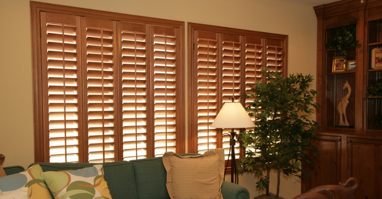 Natural wood shutters in Destin living room.